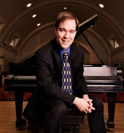 Photograph of Joshua Russell in a concert hall