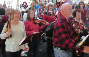 Photograph of string instrument players  at a previous Christmas Carol Playalong